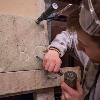 A student trying out carving techniques